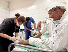 Naw (left) tending a patient